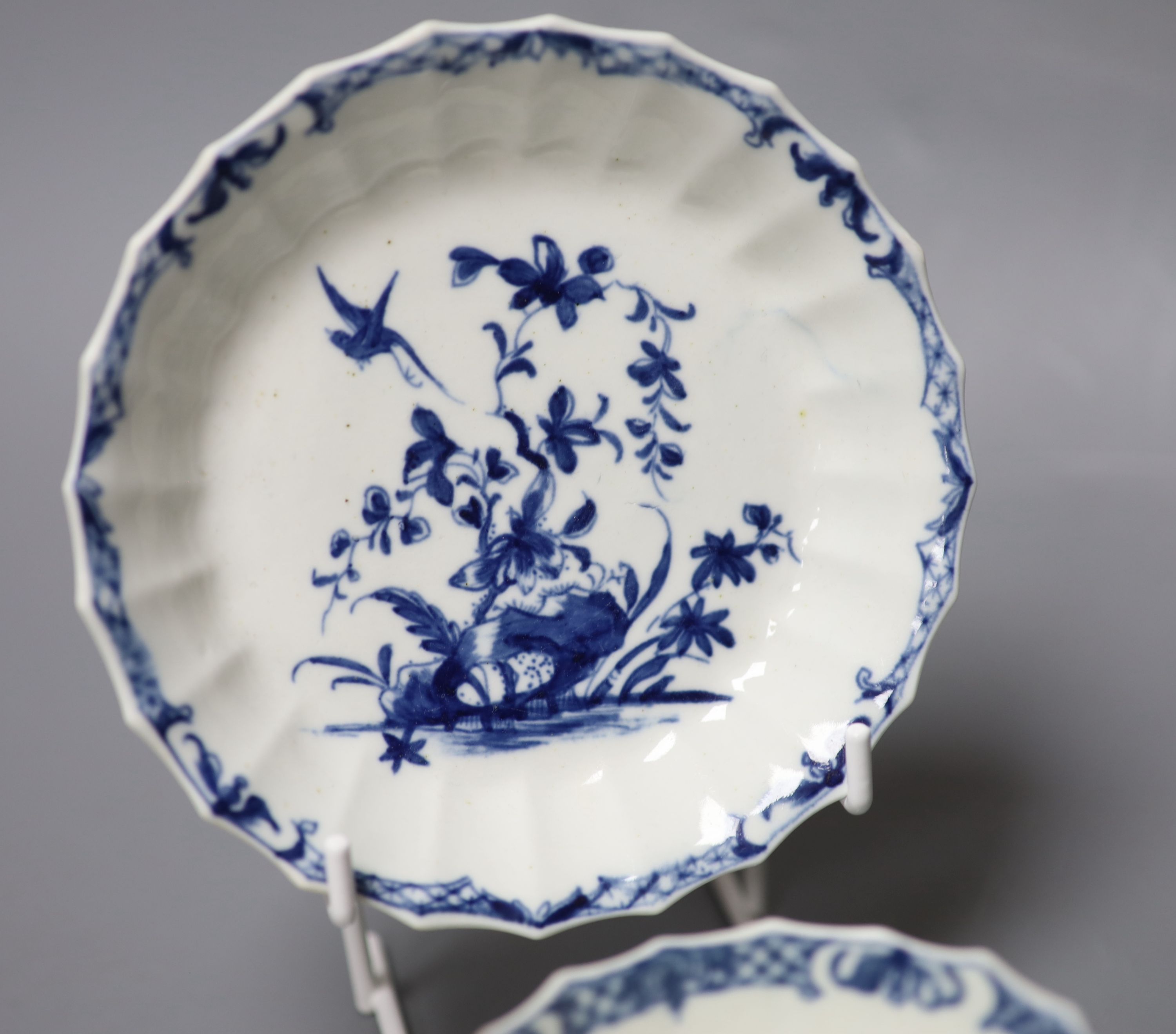 An 18th century Worcester tea bowl and saucer painted with the Hollow Rock Lily pattern, crescent marks